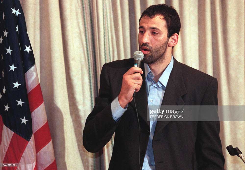 Yugoslav basketball player Vlade Divac, starting center for the Sacramento Kings, spoke during a press conference at the Regeant Beverly Wilshire Hotel in Beverly Hills, California. The movie “Wag the Dog”, which tells the story of a fake war in Albania organized by a US presidential advisor and a Hollywood producer to draw attention away from the president’s sexual misdemeanors, has received the top award from the Belgrade-based Academy of Film Arts and Science. A letter sent to the film’s director Barry Levinson and actors Dustin Hoffman and Robert De Niro was read by Divac.